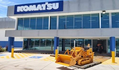 D10S-1 restored loader in front of Komatsu building