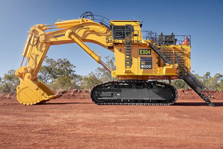 Large Komatsu mining machine standing idly on mine site