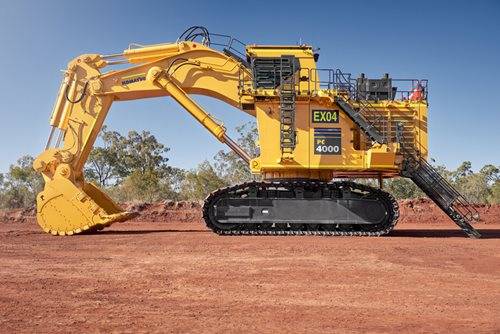 Large Komatsu mining machine standing idly on mine site